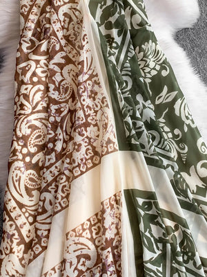 Dual-pattern V-neck cami dress with brown and green floral prints and cream panels.