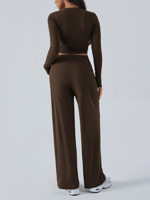 Coffee brown ribbed knit crop top and wide leg pants set from the back.