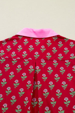 Red cotton mini dress with pink floral print, pink collar, and puff sleeves.