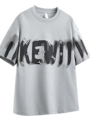 Men's oversized Dusty Gray graphic t-shirt with 3D letter print and spray paint effect.