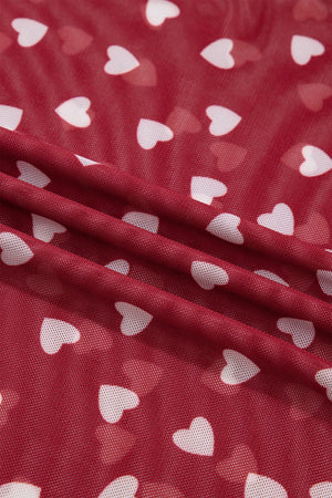 Deep red sheer t-shirt with white heart print, mesh fabric detail.