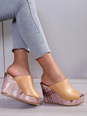 Textured wedge mules with open toe in tan, featuring a woven patterned wedge heel.