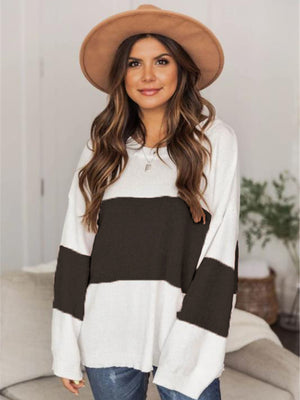 Colorblock knit pullover sweater with drop shoulder, black and white stripes, casual style.