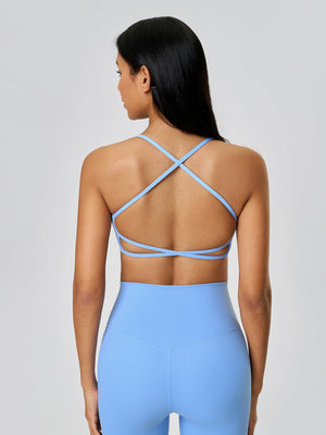 Strappy back active crop top in pastel blue with crisscross back detail.