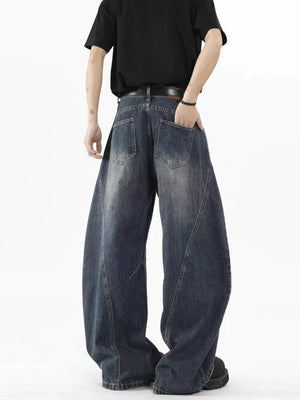 Distressed wide-leg jeans in Vintage Blue denim with a belt, shown from the back.