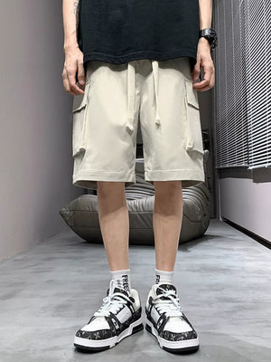 Relaxed fit apricot cargo shorts with drawstring and side pockets.