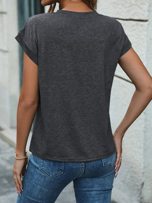 Dark gray slouchy henley tee with cuffed sleeves and a relaxed fit.