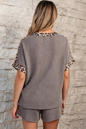 Ribbed knit two-piece set with vertical stripes and leopard trim on neckline and sleeves.
