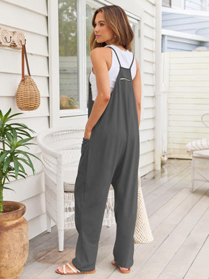 Relaxed gray pocketed overalls jumpsuit with zipper detail and wide legs.
