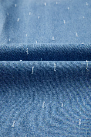 Blue denim jeans with distressed details and a raw hem.
