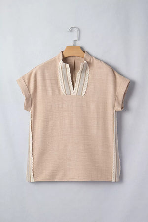 Beige crochet lace pullover with rolled sleeves and V-neck detail