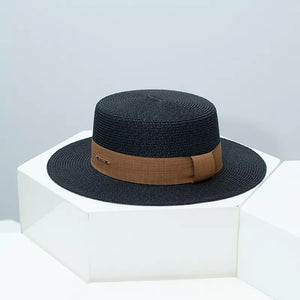 Black woven straw boater hat with brown ribbon band and gold accent