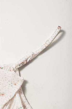 Floral print tank top with polka dots and a bow detail on the strap.