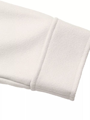 White bolero jacket cuff detail with contrast trim and stitching.