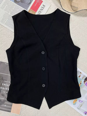 Black tailored sleeveless vest with V-neckline and button-front closure.