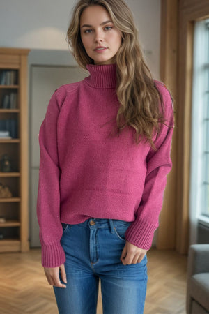 Speckled Donegal turtleneck sweater in cerise with ribbed cuffs and neckline.