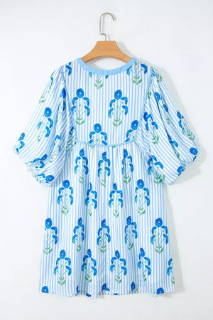 Floral stripe mini dress with puff sleeves and blue floral print.