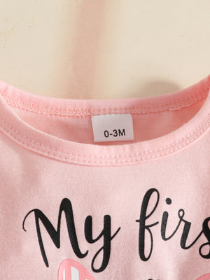 Pink baby outfit with "My first" text and bunny ears graphic.