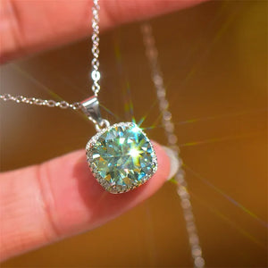 Silver cushion-cut moissanite halo pendant necklace with dazzling sparkle.
