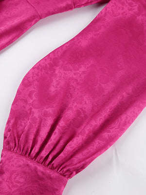 Vibrant cerise mini dress with embossed floral pattern, deep V-neck, and lantern sleeves.