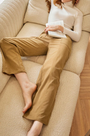 Caramel seamed front wide leg trousers with buttoned detail.