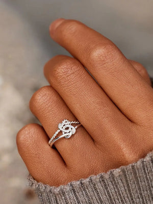 Silver rope knot ring in 925 sterling silver with twisted band detail.