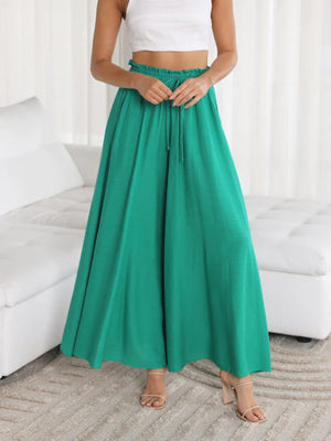 Textured drawstring palazzo trousers in turquoise with a wide leg and flowy silhouette.