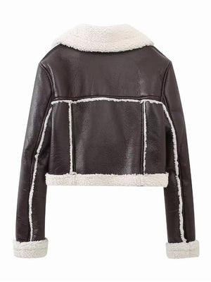 Brown cropped aviator jacket with white shearling trim and collar detail.