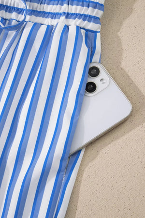 Blue and white striped maternity pants with pockets, showing a phone in the pocket.