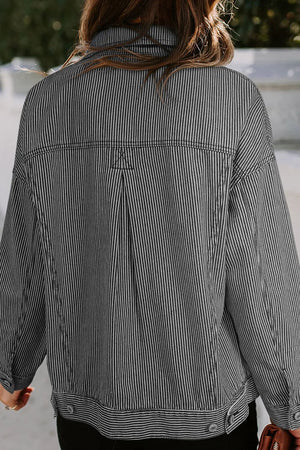 Dark pinstripe denim trucker jacket with back pleat detail and button cuffs.