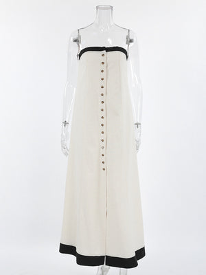Button front tube maxi dress in beige cotton blend with black trim and button detail.