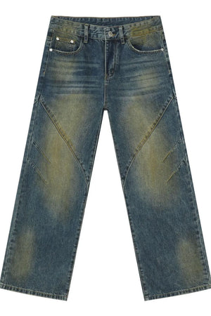 Panelled acid wash wide leg jeans in medium blue denim with distressed details.