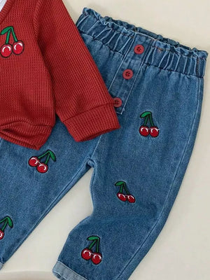 Baby set with cherry embroidery on red waffle knit top and denim pants.