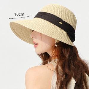 Beige woven straw wide brim sun hat with black ribbon detail