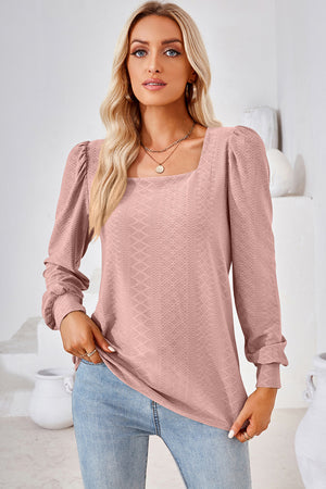 Blush pink diamond-textured puff sleeve top with square neckline.