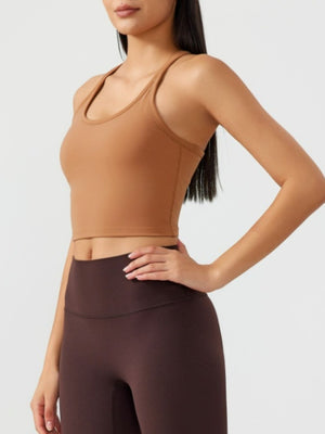 Caramel sculpted racerback crop tank top with a scoop neck.