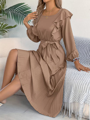 Khaki midi dress with ruffles, tie waist, and pleated skirt.