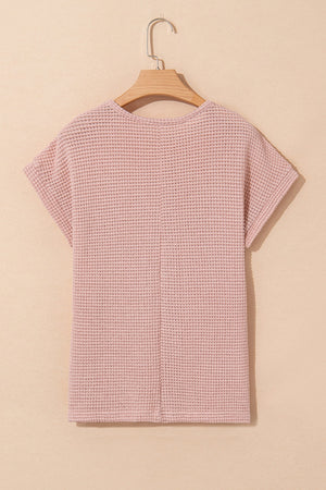 Dusty pink waffle knit top with short sleeves and a crew neck.