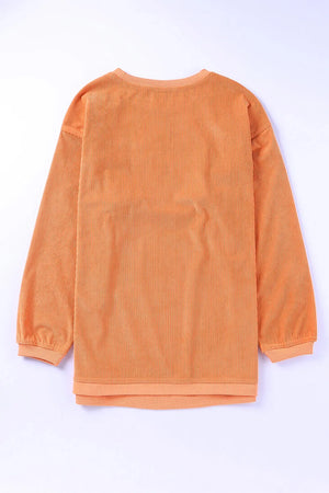 Textured sherbet crewneck sweatshirt with ribbed fabric and long sleeves.