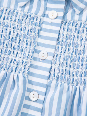 Blue and white striped button-down shirt with shirred bodice and white buttons.