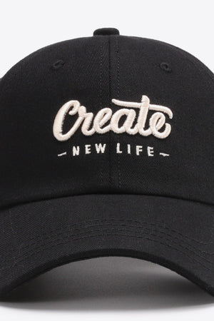Black baseball cap with embroidered "Create New Life" text.