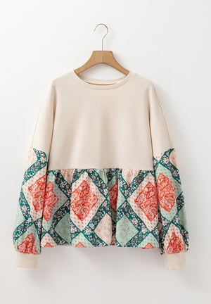 Beige peplum knit top with patchwork paisley print sleeves and hem