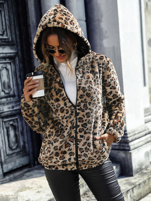 Leopard print sherpa hooded jacket in camel with black trim and zipper.