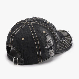 Dark ripped denim baseball cap with distressed details and contrast stitching.