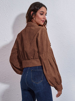 Brown corduroy cropped jacket with balloon sleeves and button details.