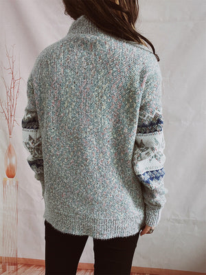 Geometric knit mockneck pullover in Cloudy Blue with patterned sleeves.