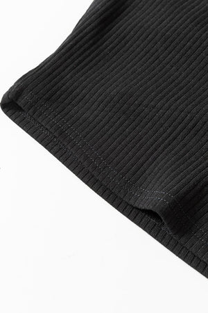 Black ribbed bodysuit detail showing stitching and fabric texture