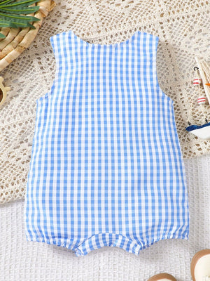 Blue gingham one-piece romper with sailboat appliqué detail.