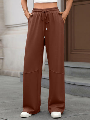 High-waist drawstring wide-leg pants in brown with pockets and a relaxed fit.