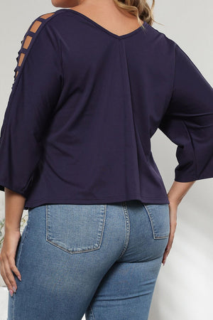 Dark navy v-neck blouse with lattice detail on the sleeves and 3/4 length sleeves.